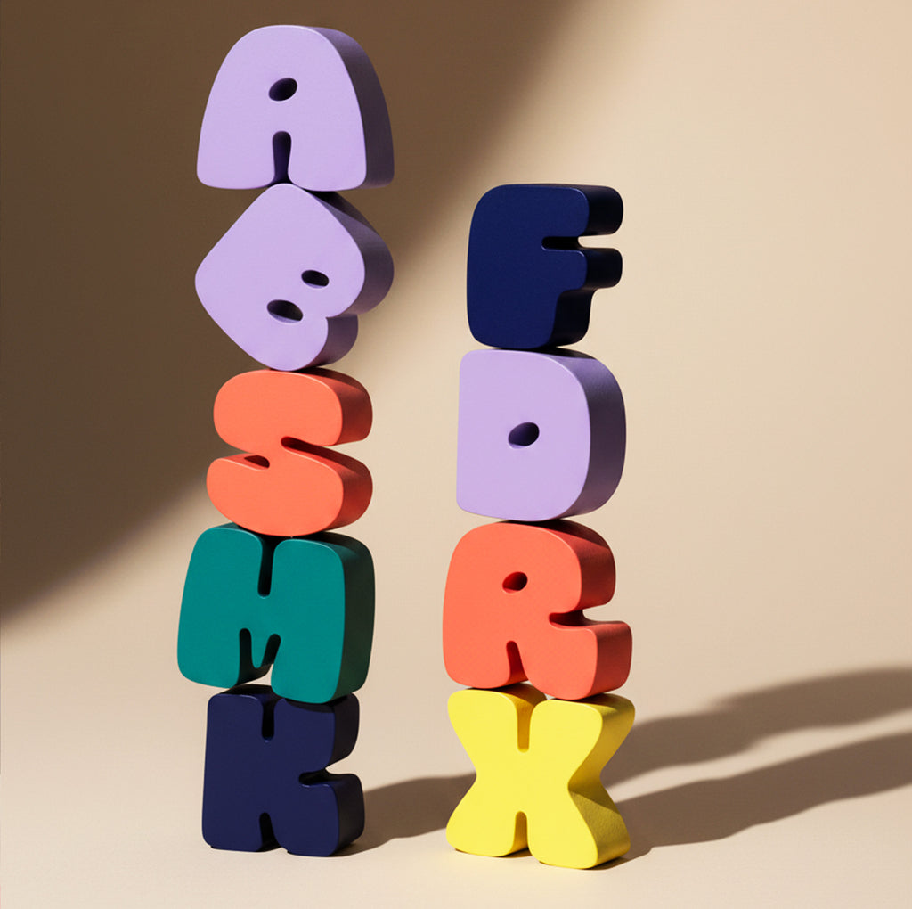 Colorful 3D letters stacked on a beige background