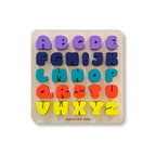 Colorful alphabet puzzle on a wooden board with letters A to Z.